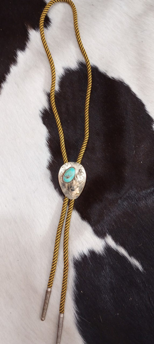 Howlite and Nickel Silver Leaf Bolo On Mustard Gold Cord